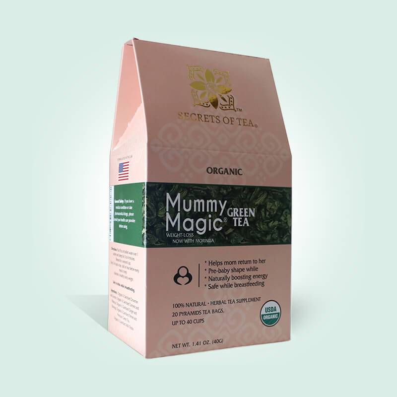 A box of Organic Slimming Herbal Tea featuring Moringa, with sachets inside, set against a natural backdrop.