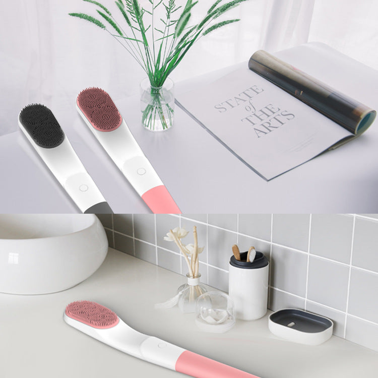 Scrubbing Device Bathing Massage Scrubbing Beauty Device in pink and gray, showcasing its long handle and soft silicone bristles for deep cleansing.