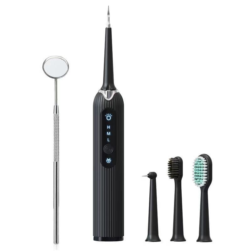 Sonic Dental Scaler in black color with multiple cleaning heads and USB charging cable, designed for effective teeth whitening and calculus removal.