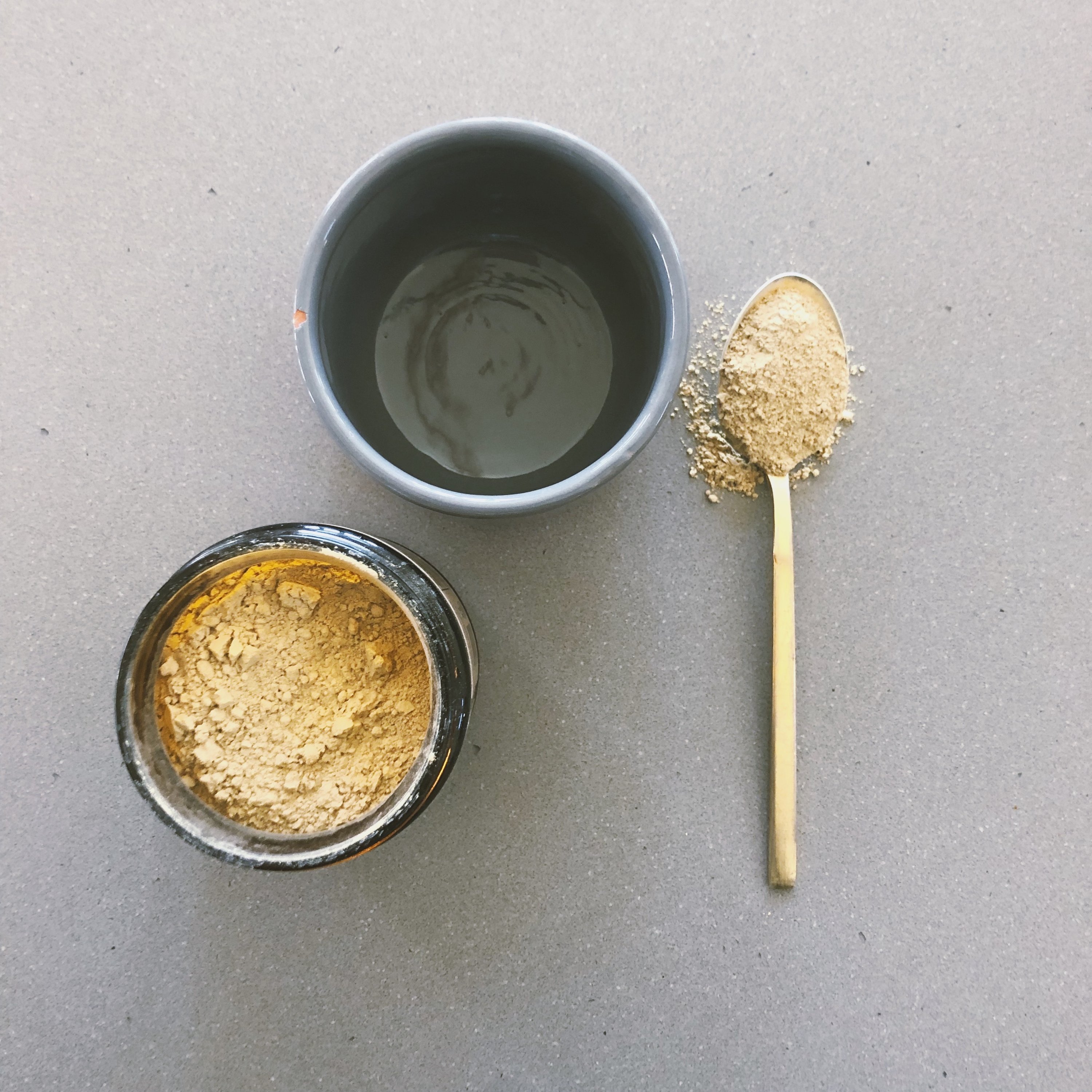 A 9 oz glass jar of Triphala, an Ayurvedic herbal supplement containing Haritaki, Amalaki, and Bibhitaki, designed for digestion and immune support.