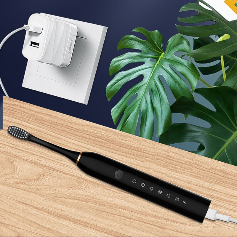 Ultrasonic Electric Toothbrush with USB charging, featuring 6 modes and a sleek design, ideal for adults.