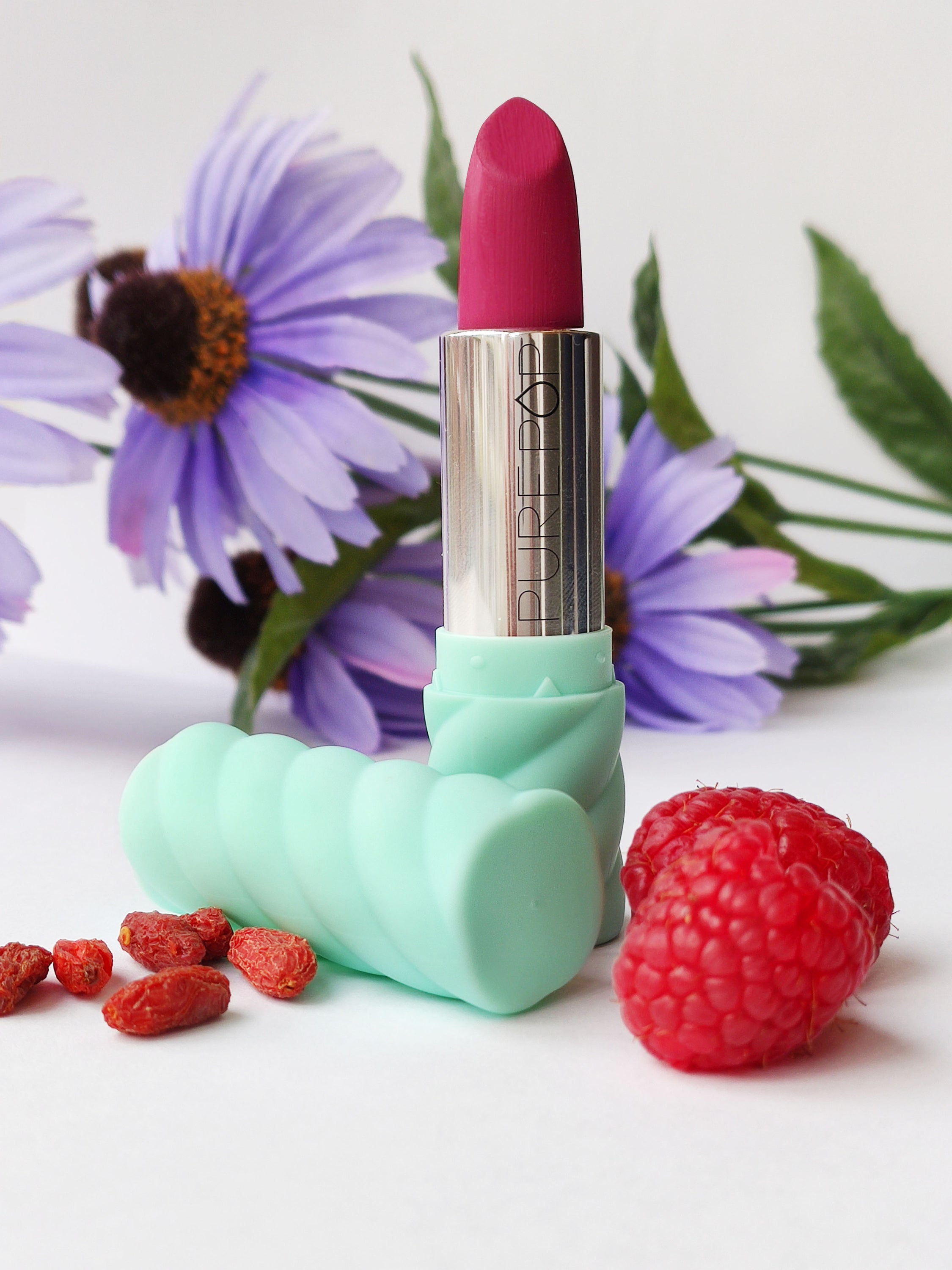 05 Rossetto 'Mistress of Colorland' lipstick in vibrant plum shade, showcasing its creamy texture and elegant packaging.