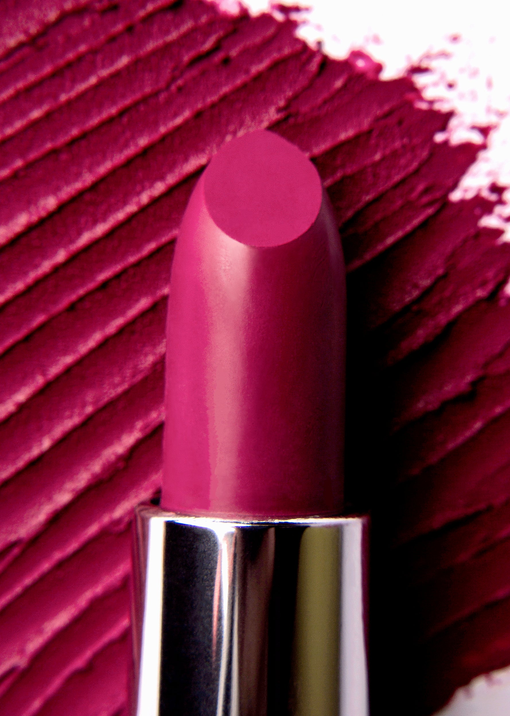 05 Rossetto 'Mistress of Colorland' lipstick in vibrant plum shade, showcasing its creamy texture and elegant packaging.