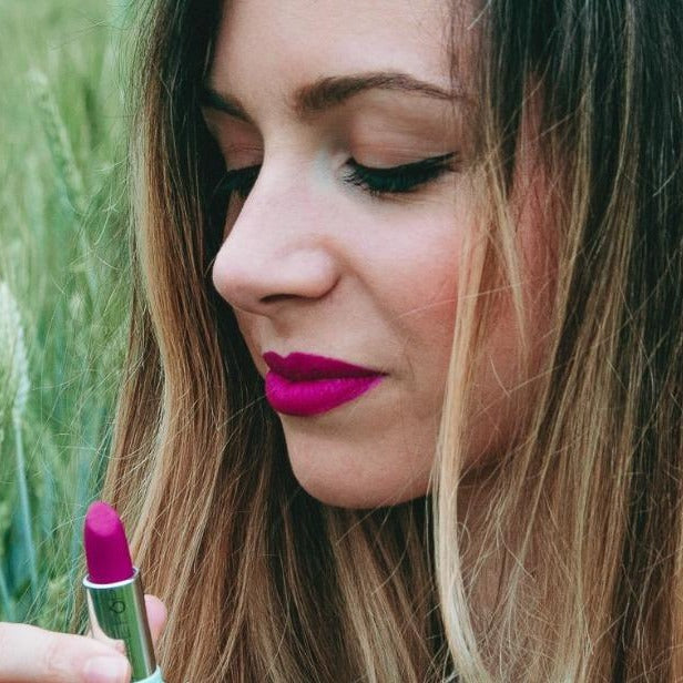 05 Rossetto 'Mistress of Colorland' lipstick in vibrant plum shade, showcasing its creamy texture and elegant packaging.