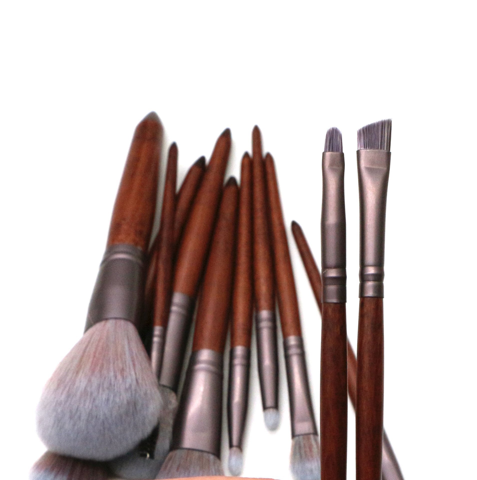 11 Pieces High Quality Makeup Brush Set featuring synthetic hair bristles, matte coffee aluminum ferrules, and natural wood handles.