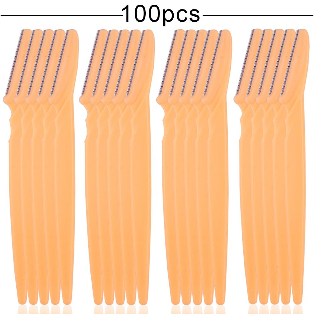 100Pcs Eyebrow Cutting Knife Blades in various colors, showcasing their sleek design and stainless steel blades for precise eyebrow shaping.