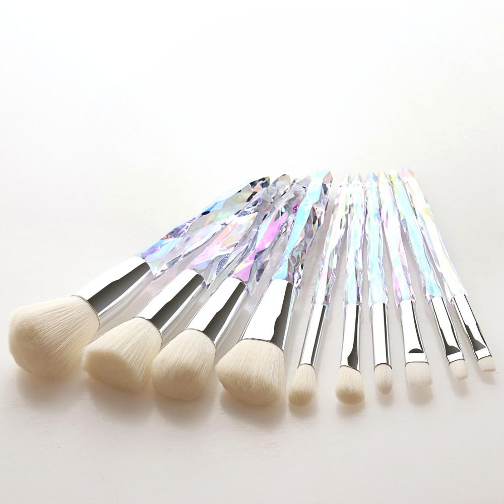 A set of 10 transparent crystal diamond makeup brushes with colorful handles, showcasing their elegant design and high-quality bristles.