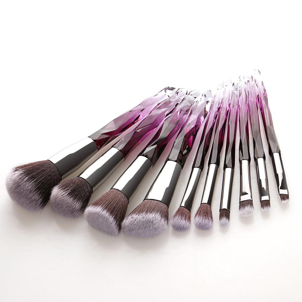 A set of 10 transparent crystal diamond makeup brushes with colorful handles, showcasing their elegant design and high-quality bristles.