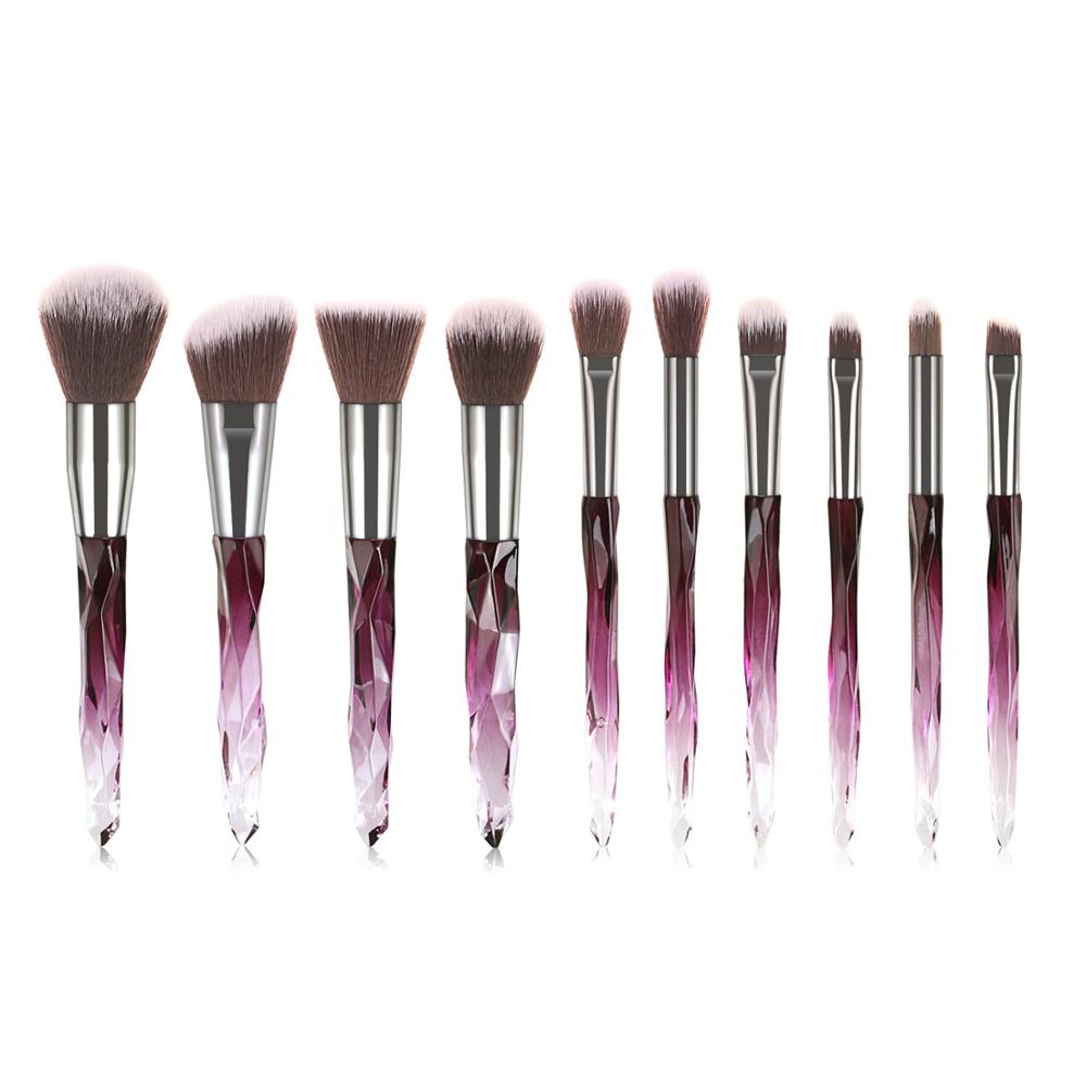 A set of 10 transparent crystal diamond makeup brushes with colorful handles, showcasing their elegant design and high-quality bristles.