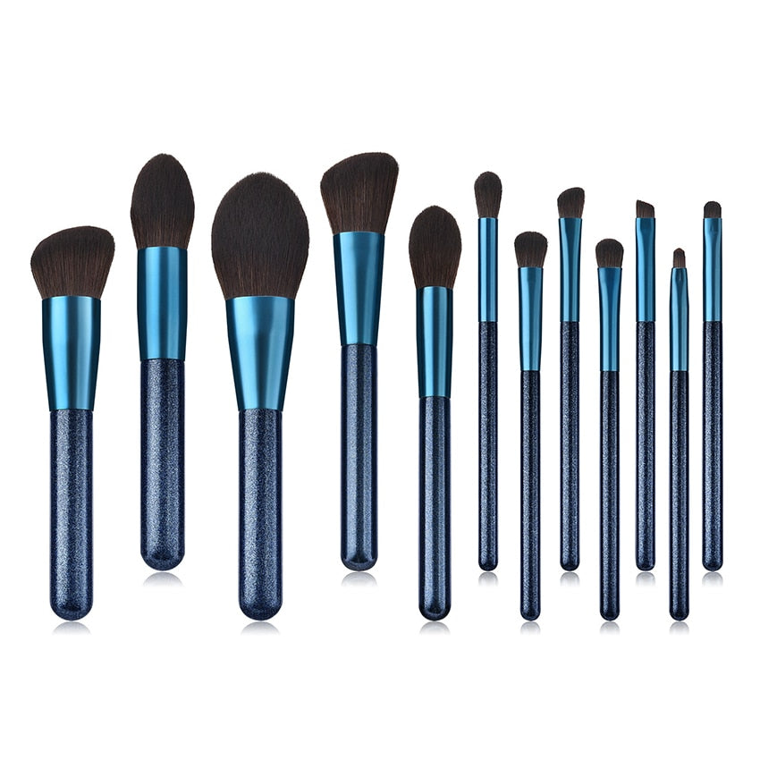 A set of 12 blue makeup brushes with soft nylon wool bristles and comfortable wooden handles, perfect for various makeup applications.