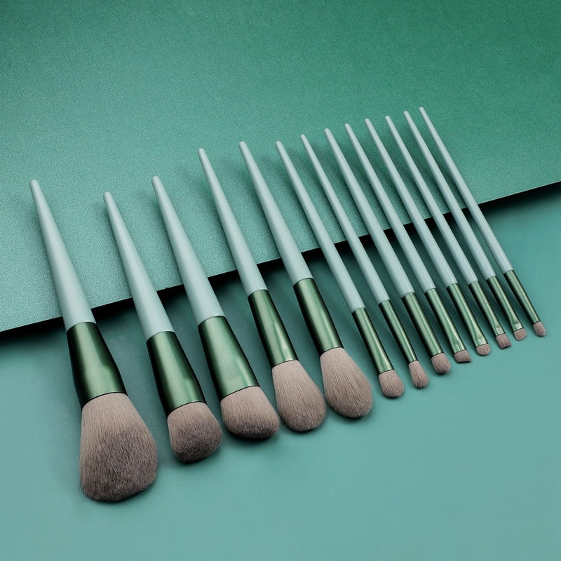 A set of 13 wooden conical makeup brushes with soft synthetic bristles, displayed elegantly to showcase their quality and design.