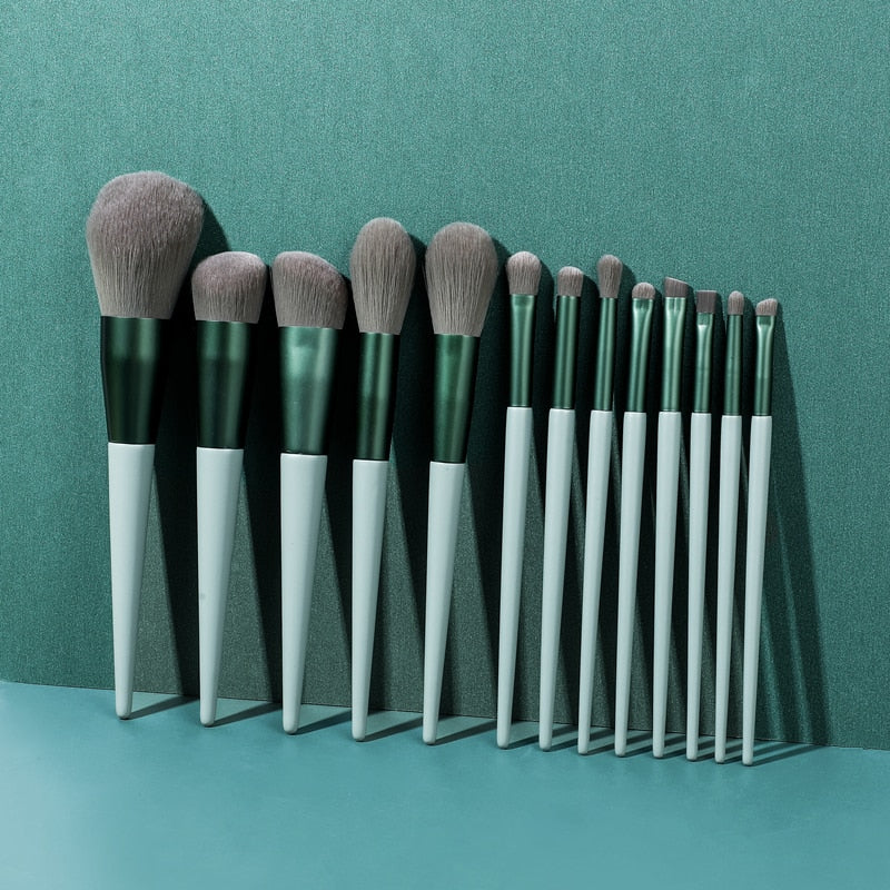 A set of 13 wooden conical makeup brushes with soft synthetic bristles, displayed elegantly to showcase their quality and design.