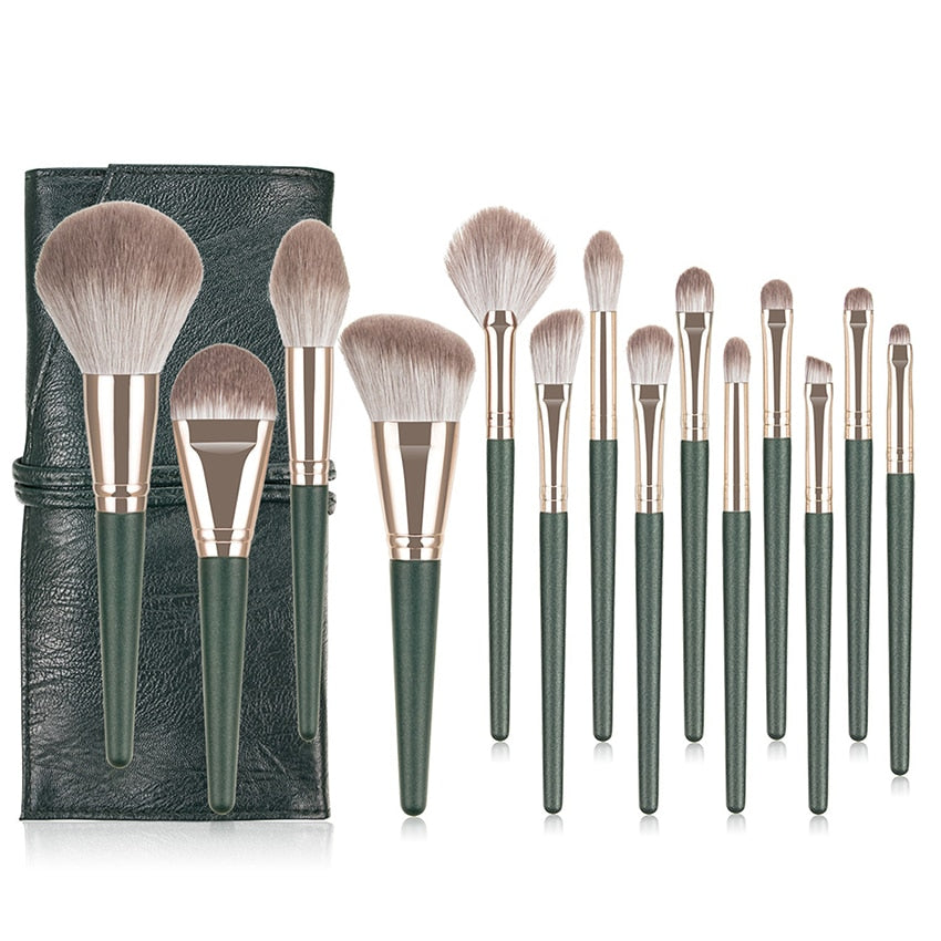 14-piece Green Cloud Makeup Brushes Set with wooden handles and nylon bristles, neatly arranged in a leather bag.