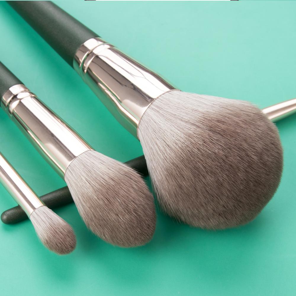 14pcs Green Makeup Brushes Set featuring various brush types for foundation, powder, and blush application, with soft plant fibre bristles and polished handles.