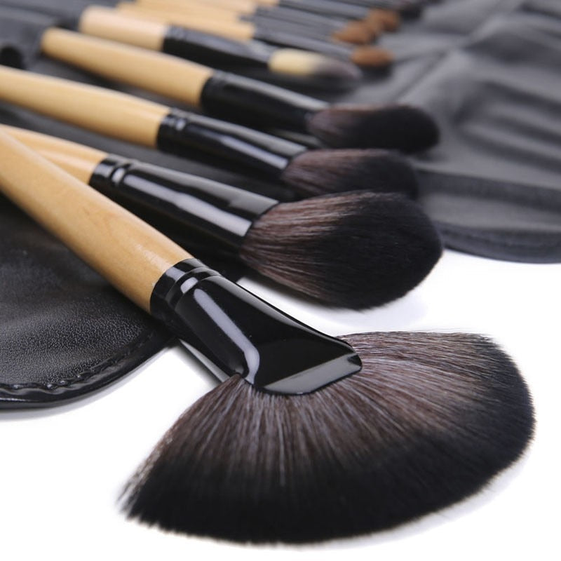 24 pcs professional makeup brush set with leather case, featuring soft synthetic hair bristles for flawless application.