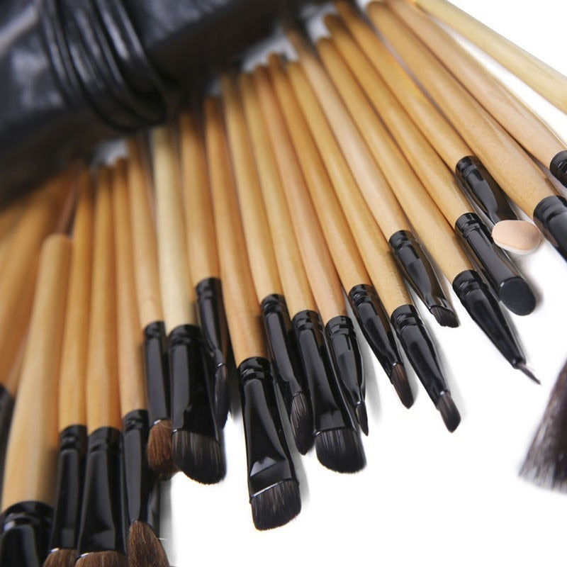 24 pcs professional makeup brush set with leather case, featuring soft synthetic hair bristles for flawless application.