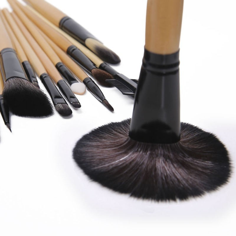 24 pcs professional makeup brush set with leather case, featuring soft synthetic hair bristles for flawless application.