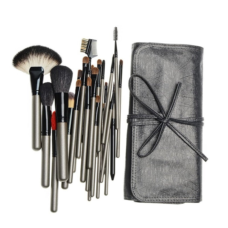 A complete set of 26 high-quality makeup brushes displayed in a stylish leather holder case, showcasing various brush shapes and sizes.