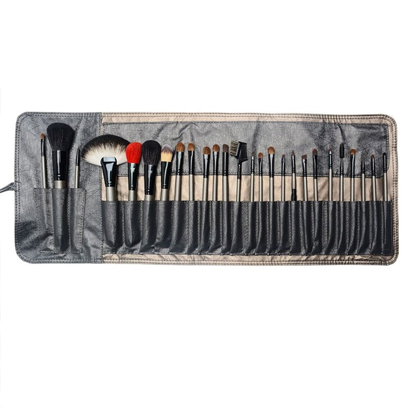 A complete set of 26 high-quality makeup brushes displayed in a stylish leather holder case, showcasing various brush shapes and sizes.