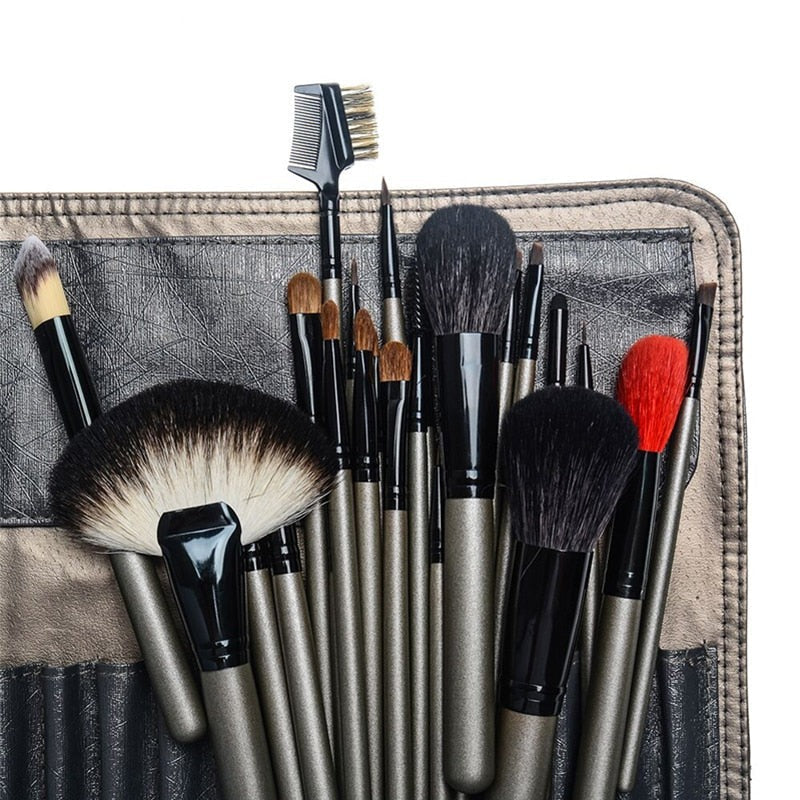 A complete set of 26 high-quality makeup brushes displayed in a stylish leather holder case, showcasing various brush shapes and sizes.