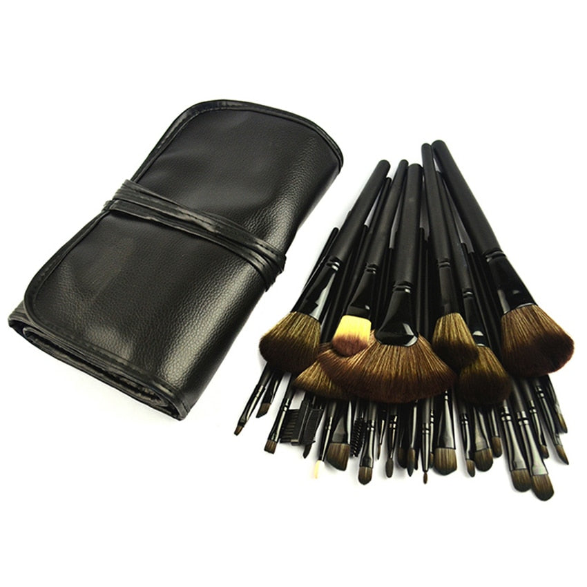 32-piece black professional makeup brushes set with wooden handles and nylon bristles, packaged for travel convenience.