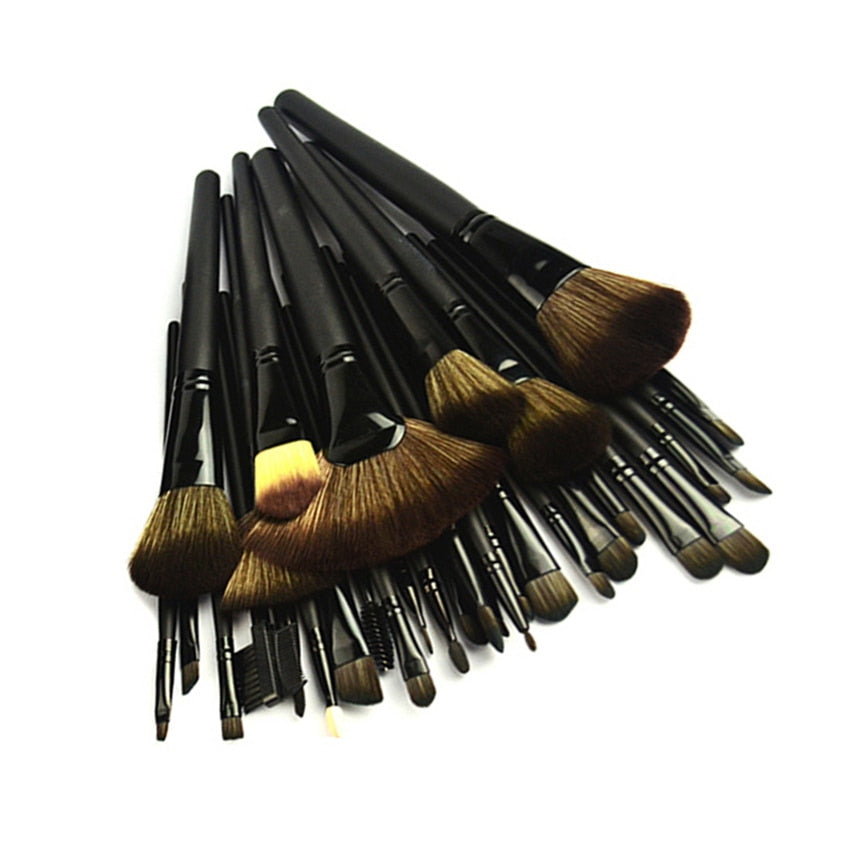 32-piece black professional makeup brushes set with wooden handles and nylon bristles, packaged for travel convenience.