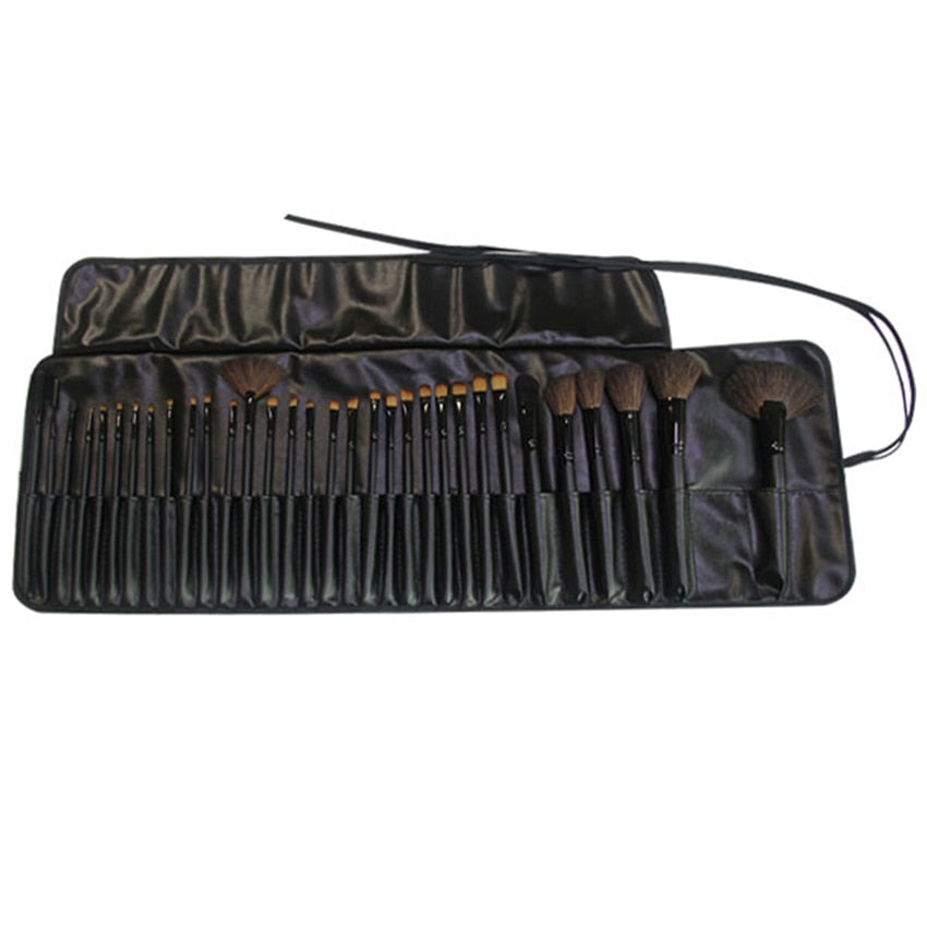 32-piece black professional makeup brushes set with wooden handles and nylon bristles, packaged for travel convenience.