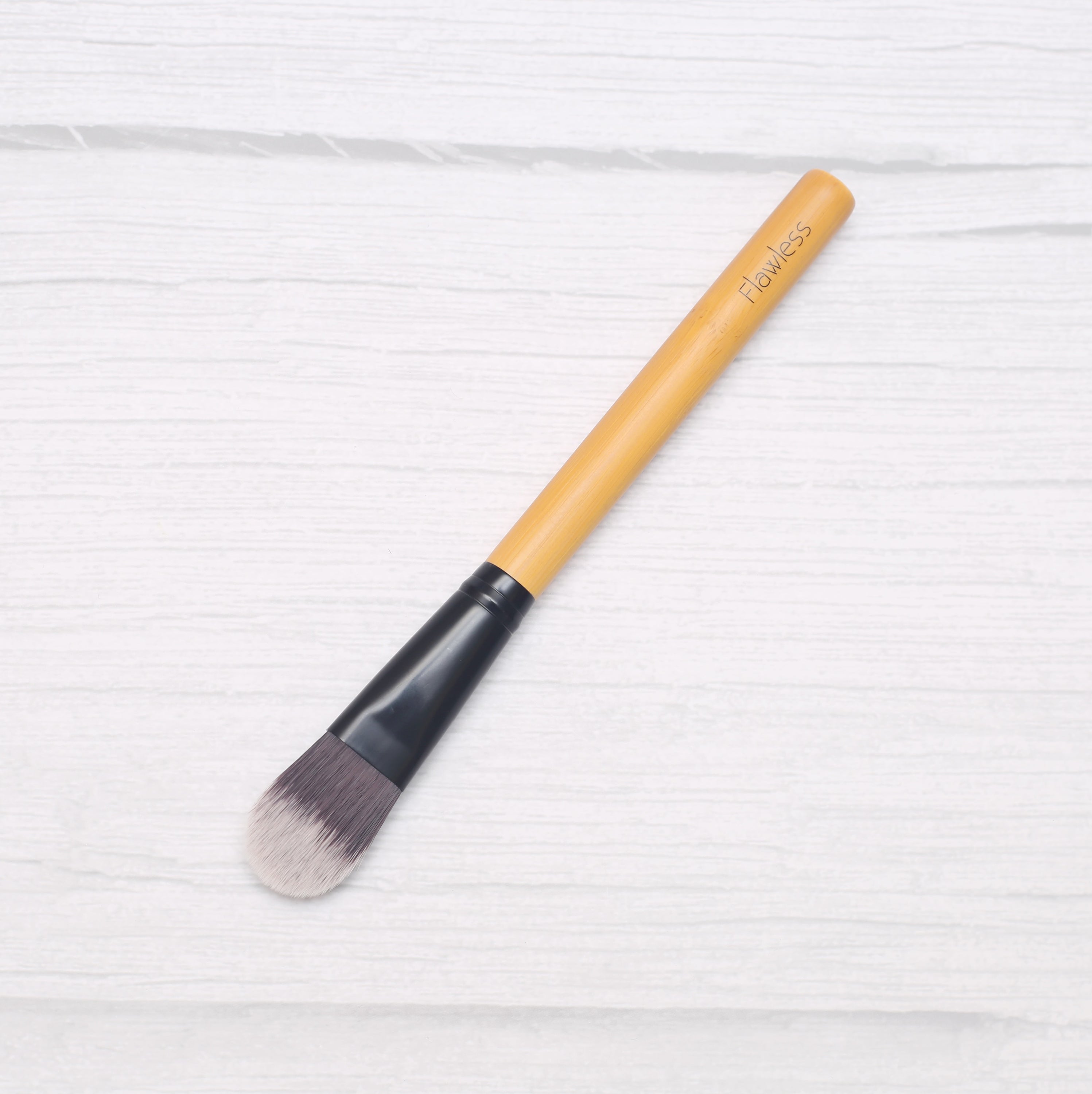 Classic Foundation Brush designed for seamless foundation application and contouring, featuring a flattened shape for precision.