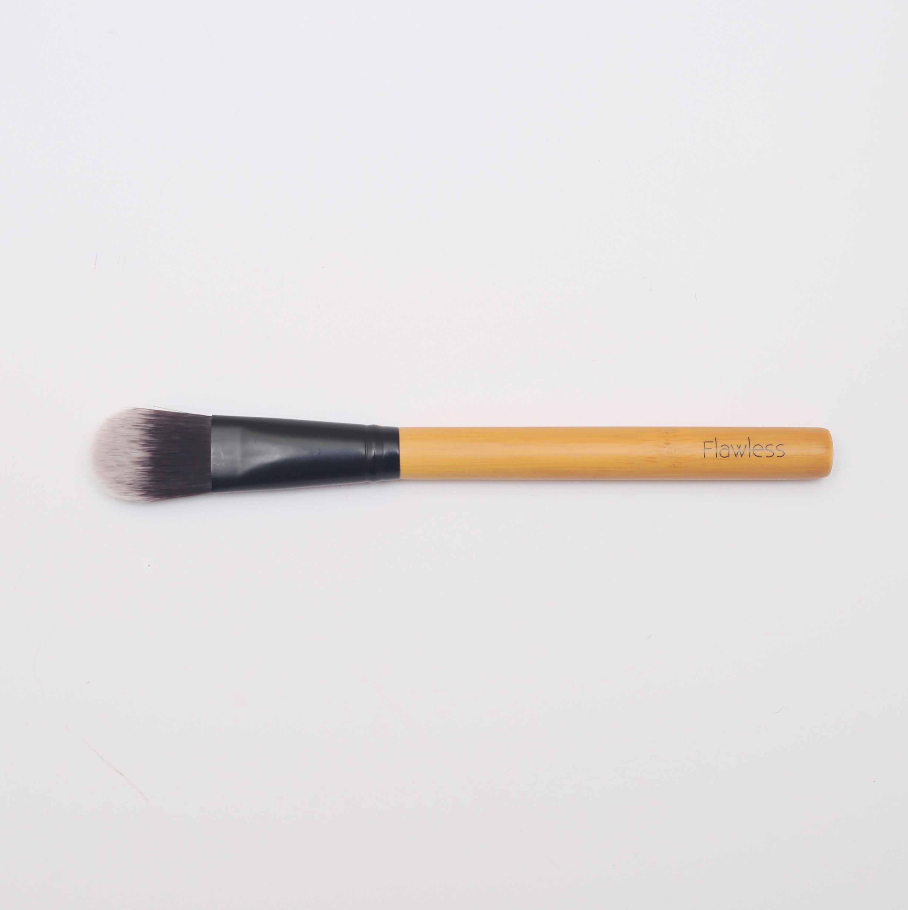 Classic Foundation Brush designed for seamless foundation application and contouring, featuring a flattened shape for precision.