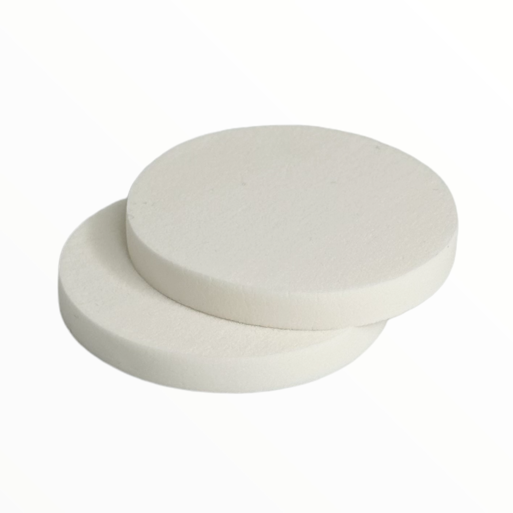 Two latex-free compact pressed power replacement sponges in a pack, showcasing their soft texture and ideal size for makeup application.