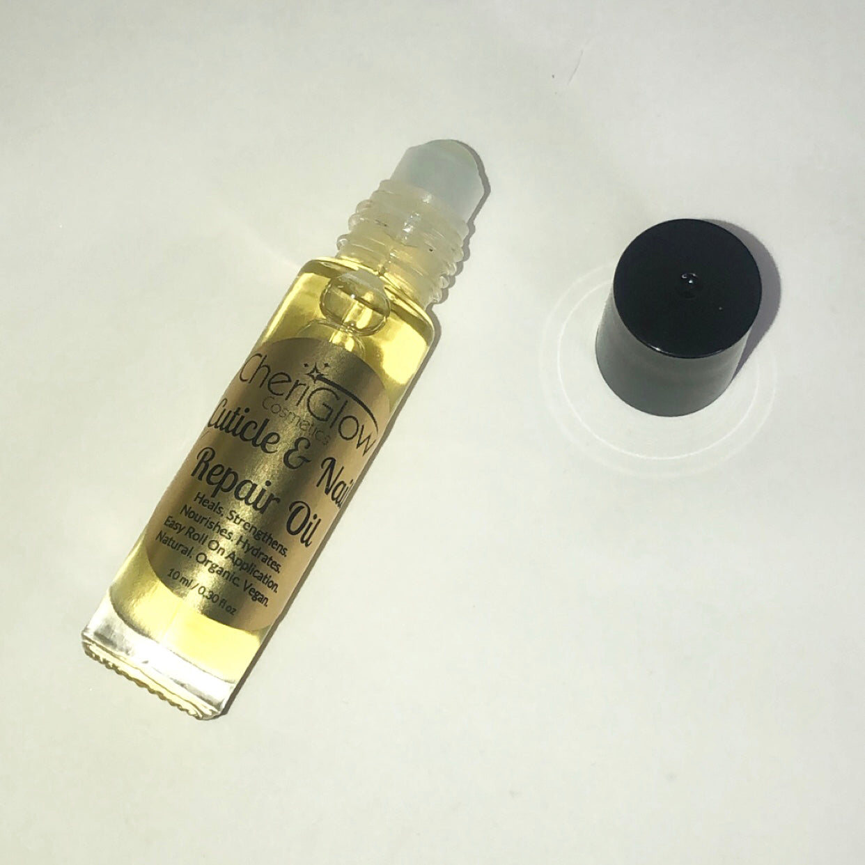 Cuticle & Nail Repair Oil in a roll-on bottle, showcasing its nourishing ingredients and convenient applicator.