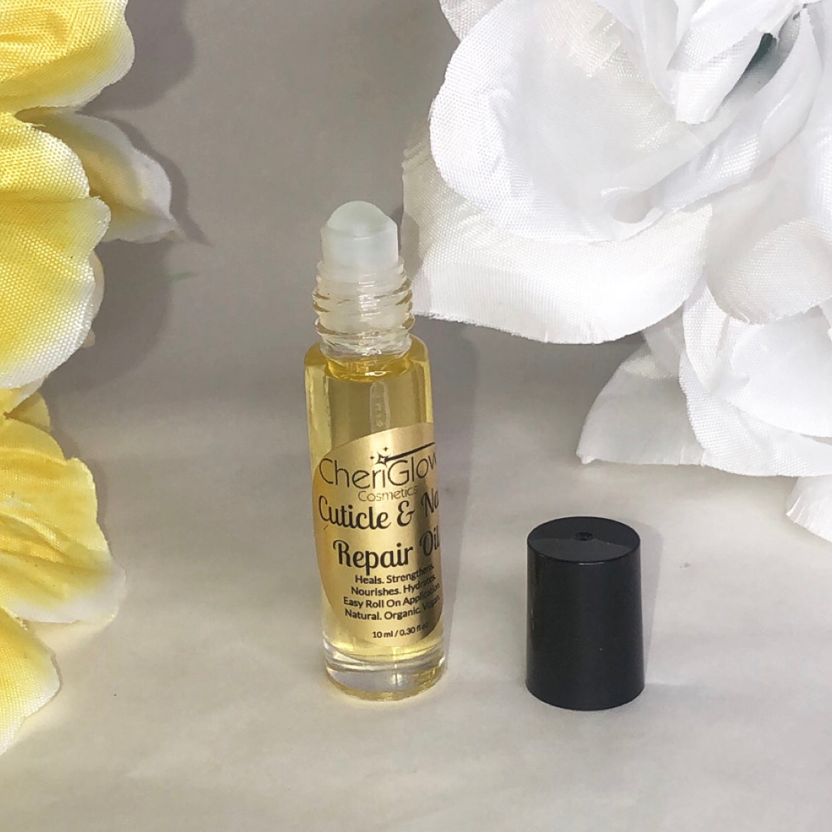 Cuticle & Nail Repair Oil in a roll-on bottle, showcasing its nourishing ingredients and convenient applicator.