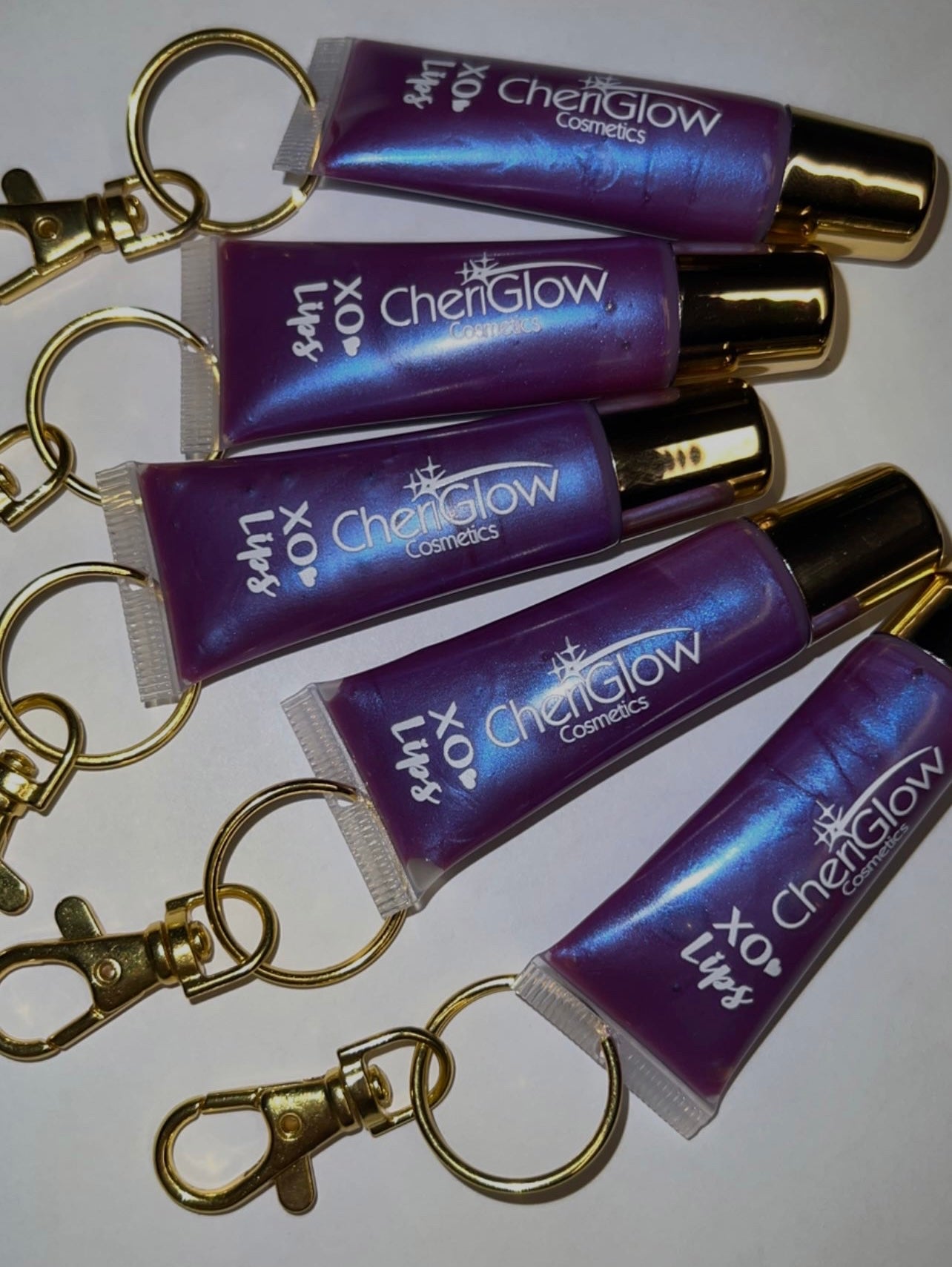 Extraterrestrial - XO Keychain Lipgloss with a keychain attachment, featuring a sleek design and vibrant packaging.