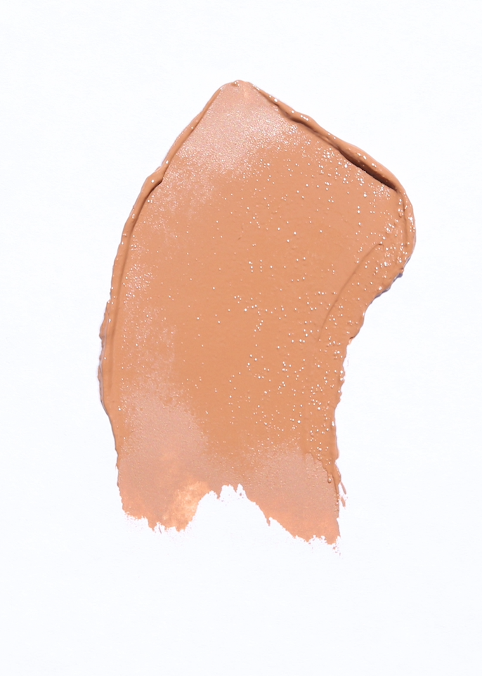 Faultless foundation in medium warm honey beige shade, showcasing its creamy texture and packaging.