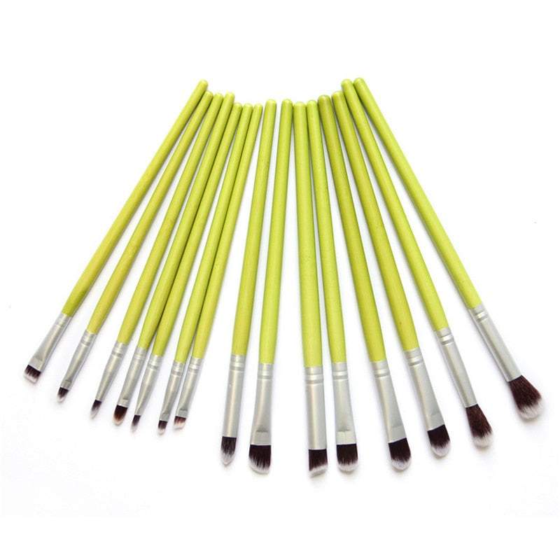 A complete set of 23 eco-friendly green bamboo makeup brushes with black to white tipped nylon bristles, elegantly displayed.