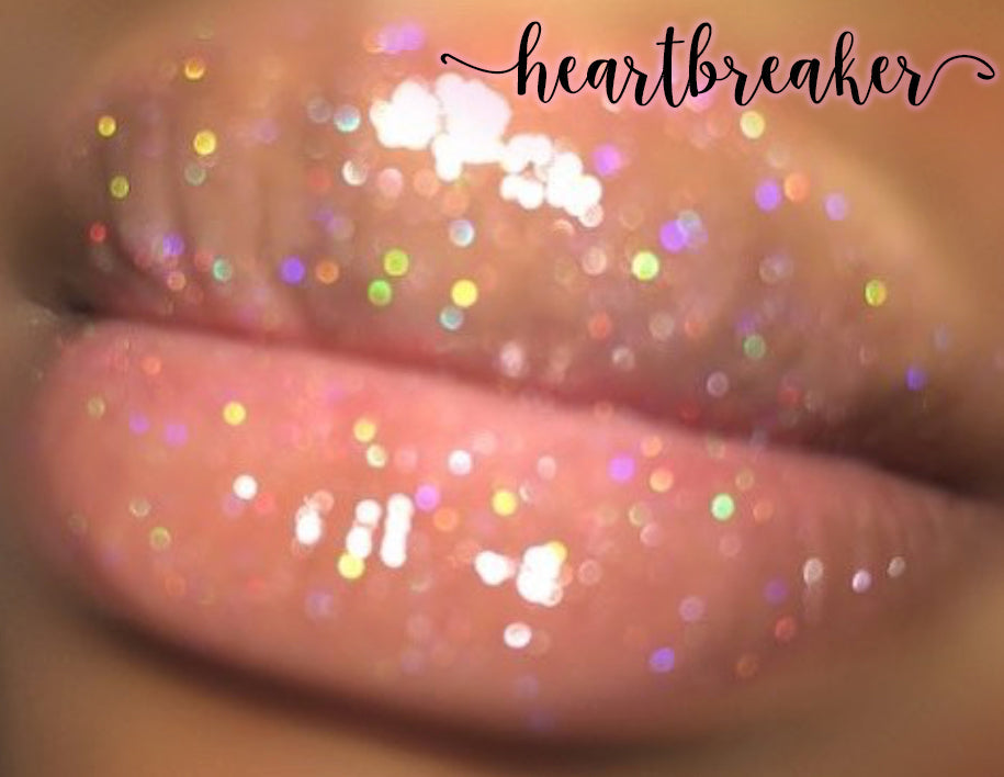 Heartbreaker - XO Royalty Lipgloss showcasing a shimmering glitter effect in various colors.