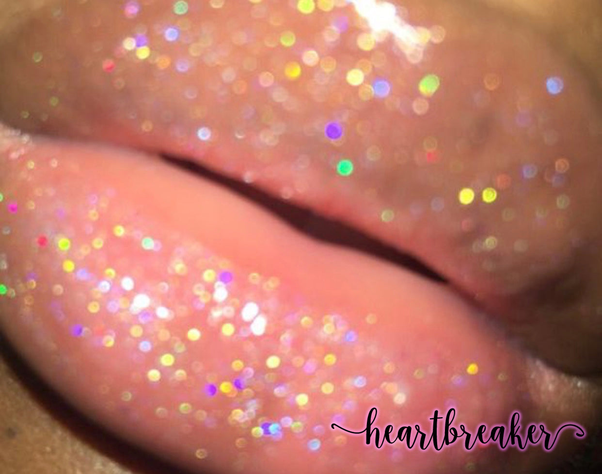 Heartbreaker - XO Royalty Lipgloss showcasing a shimmering glitter effect in various colors.