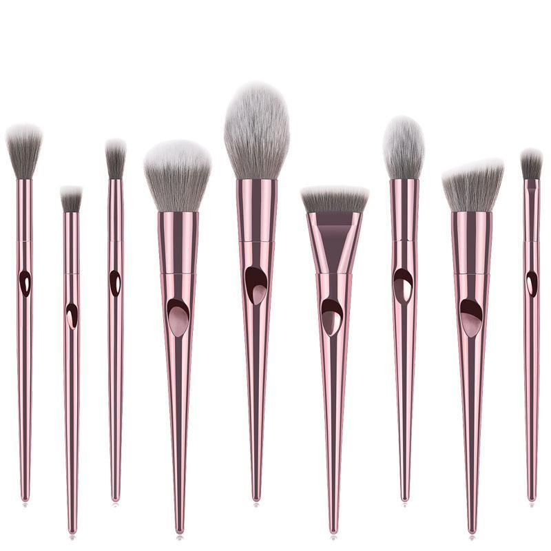 A set of 10 long makeup brushes with nylon bristles and plastic handles, ideal for professional makeup application.