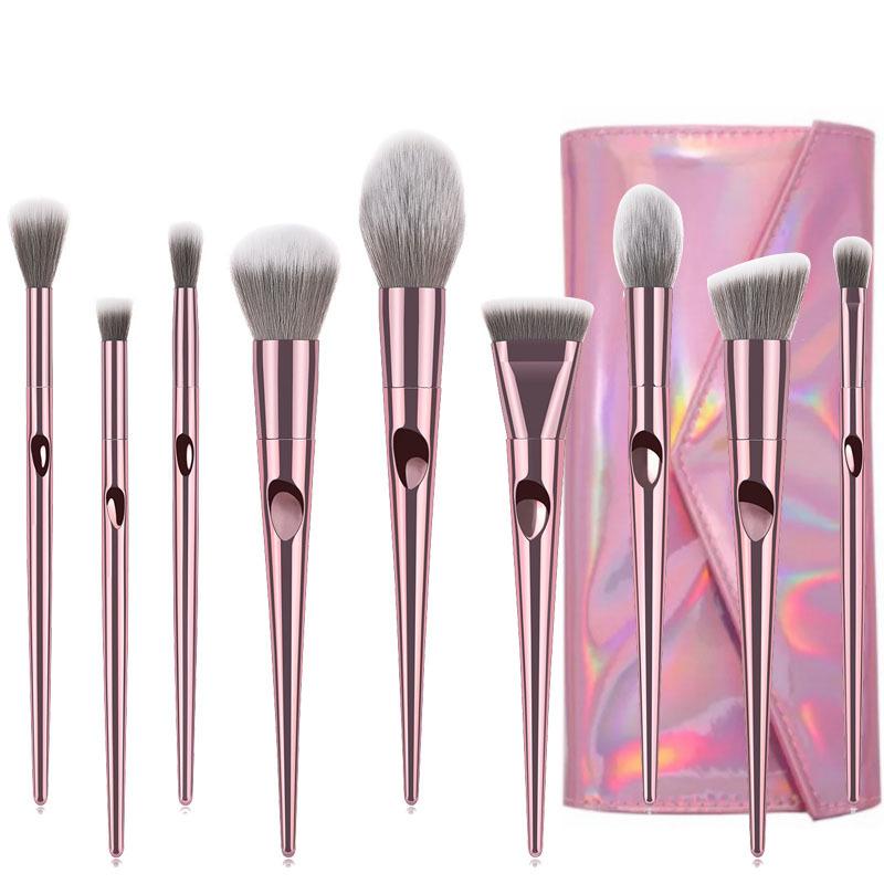 A set of 10 long makeup brushes with nylon bristles and plastic handles, ideal for professional makeup application.