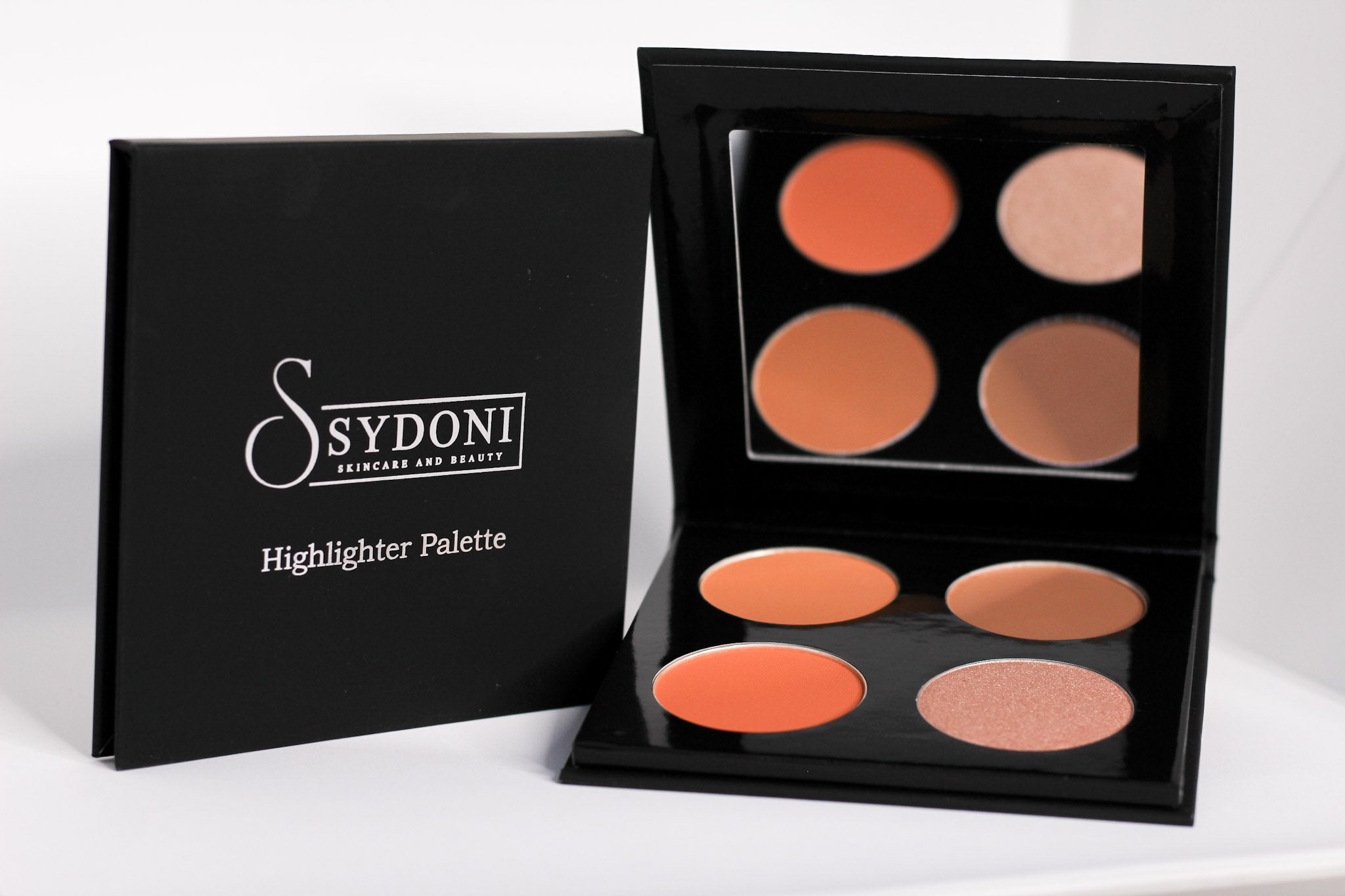 HIGHLIGHT AND CONTOUR PALETTE (MED/DEEP) showcasing multiple shades in a compact design, perfect for contouring and highlighting.