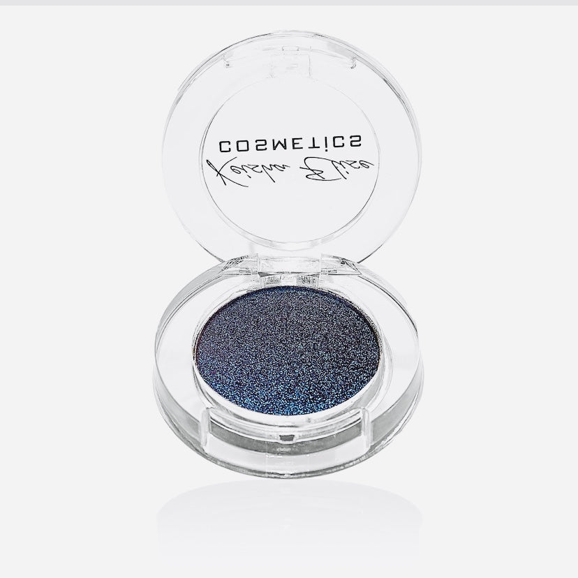 A collection of Boss Mom holographic eyeshadows in bronze, teal gold, and purple shades, elegantly displayed in a stylish packaging.