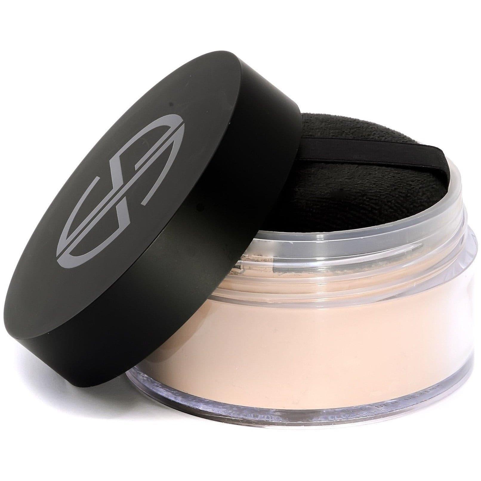 Studio Gear Cosmetics Invisible Loose Powder in a sleek container, showcasing its fine texture and lightweight formula for a flawless matte finish.