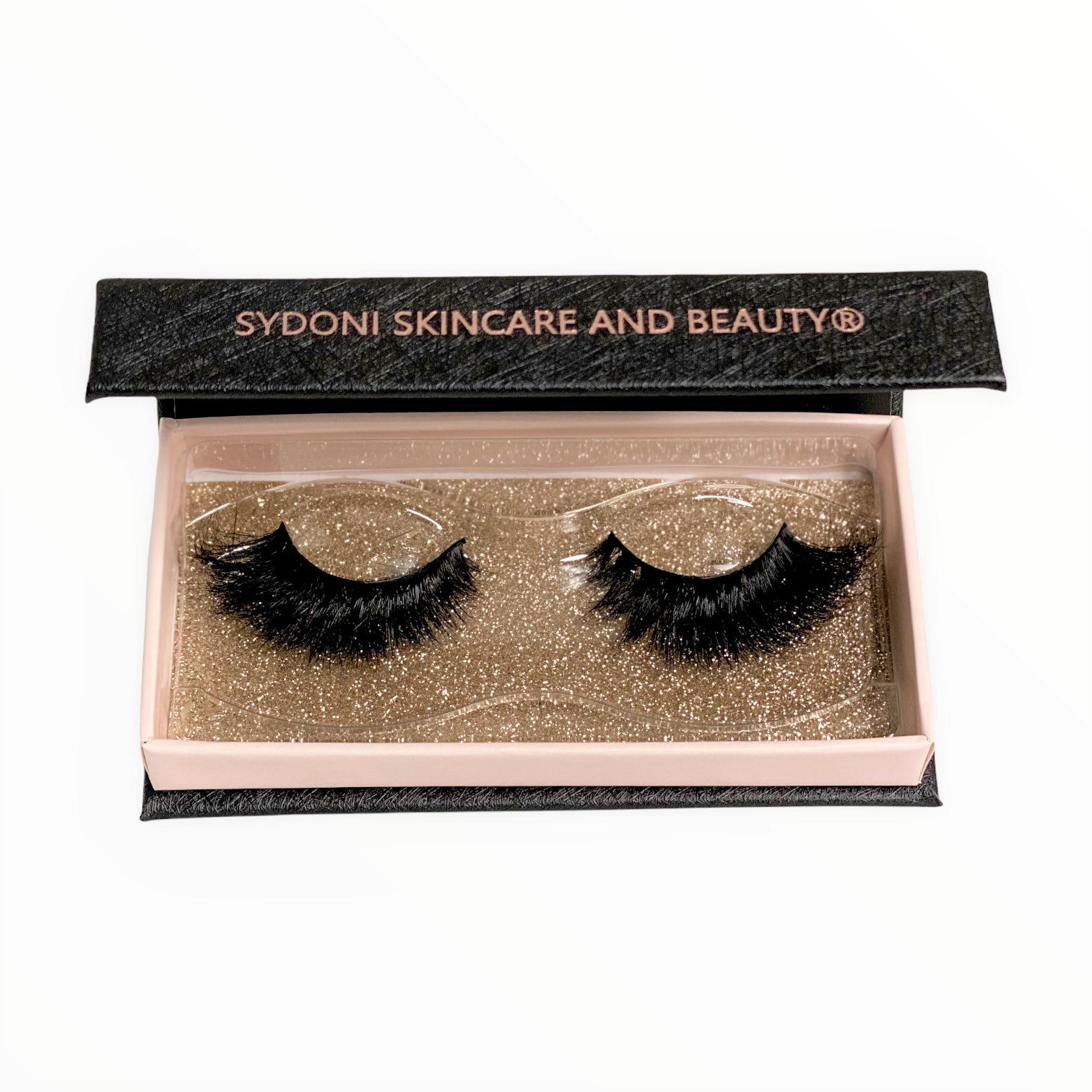 A pair of luxurious LOLA Mink Lashes made from 100% real mink fur, showcasing their wispy and 3D design.