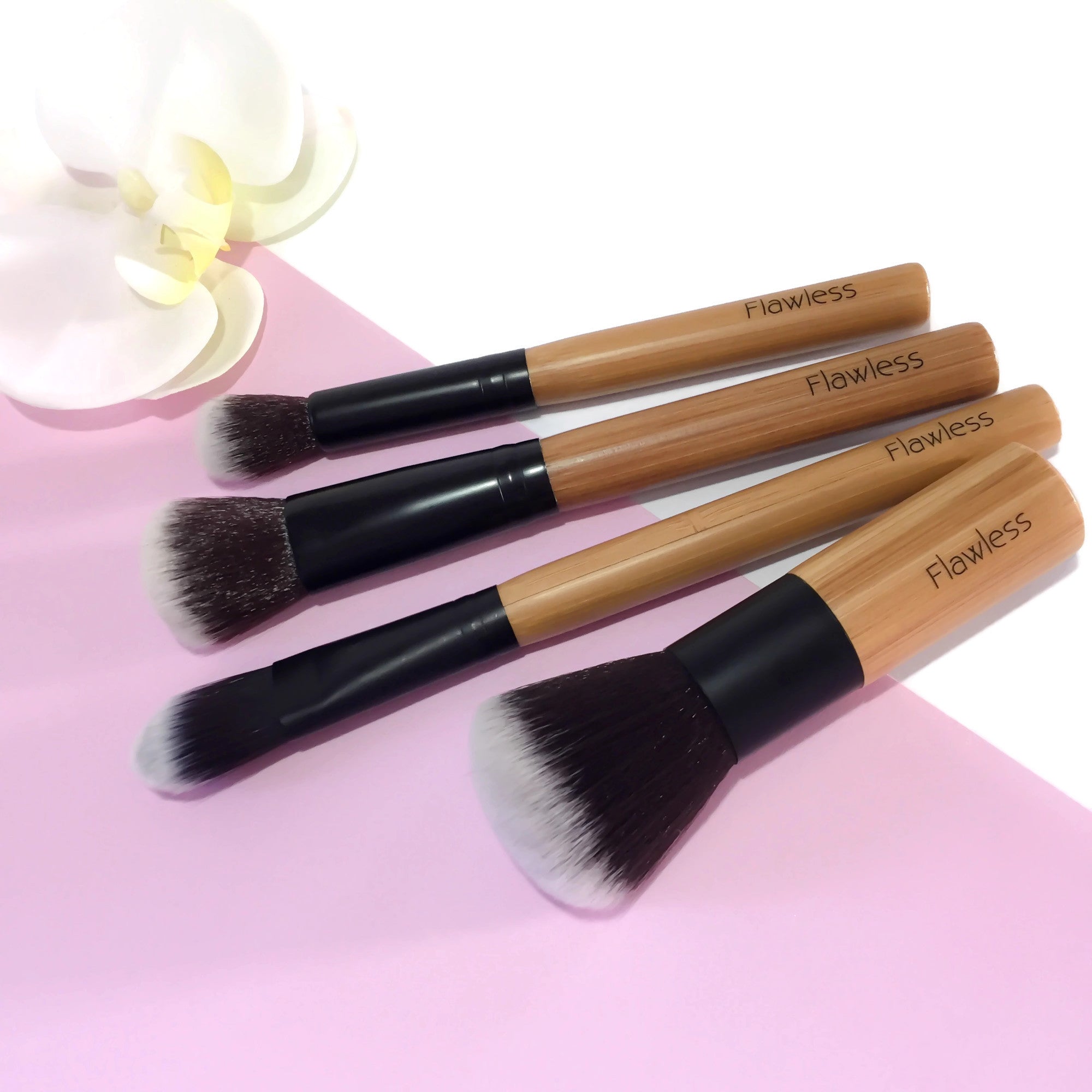 Eco-friendly Makeup Brush Set featuring four bamboo brushes and an organic cotton storage bag.