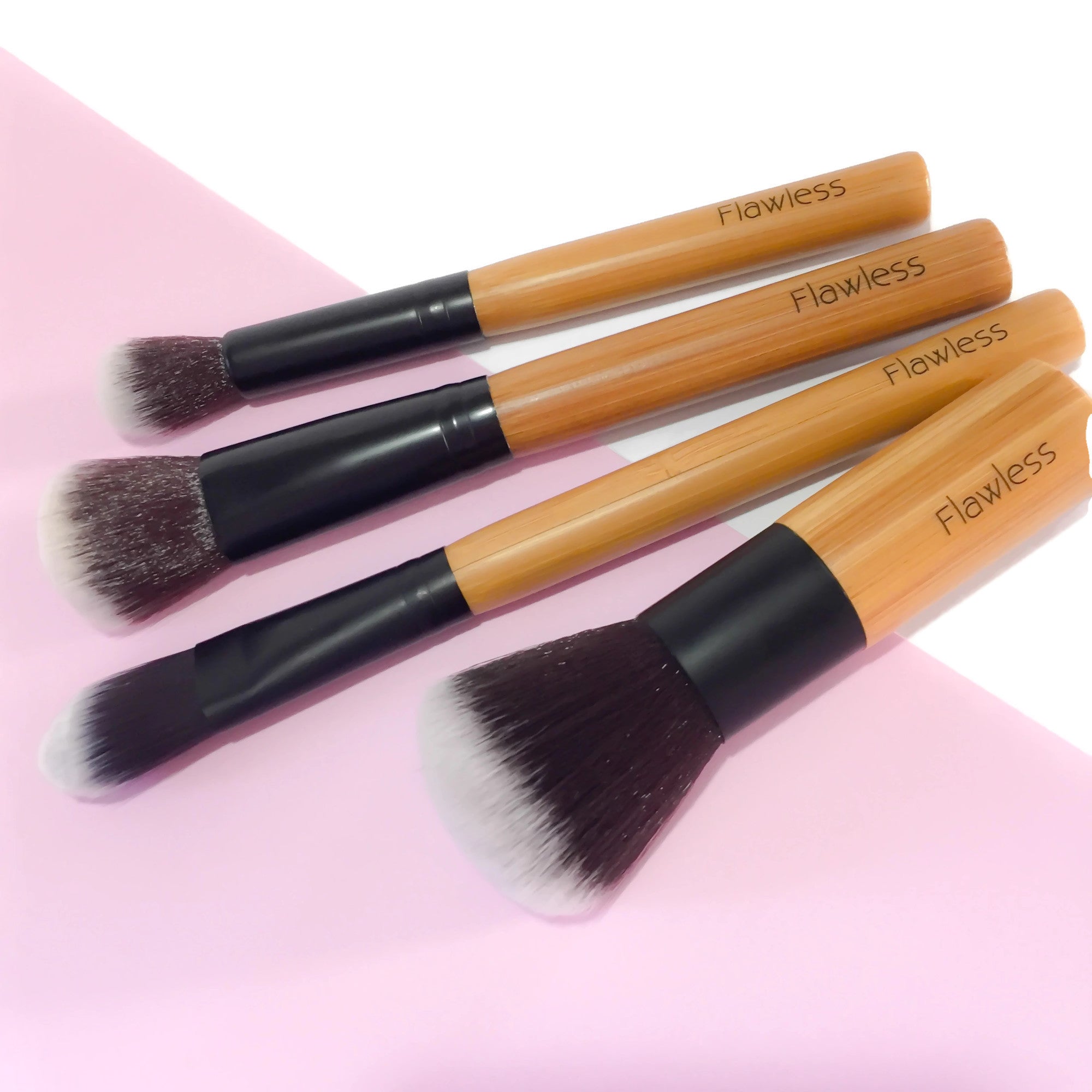 Eco-friendly Makeup Brush Set featuring four bamboo brushes and an organic cotton storage bag.