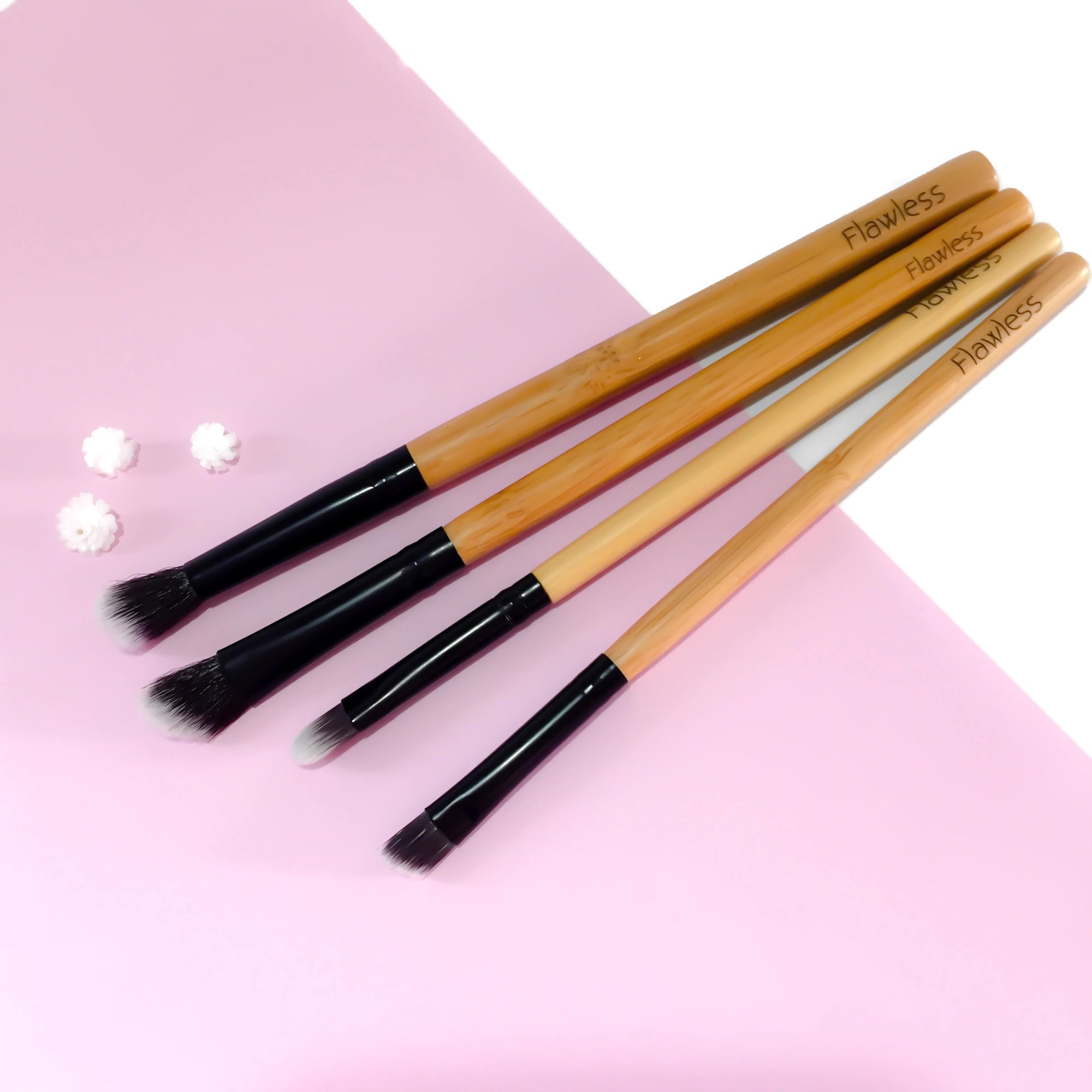 A four-piece vegan makeup brush set with bamboo handles, designed for eye makeup application, featuring angled and blending brushes.