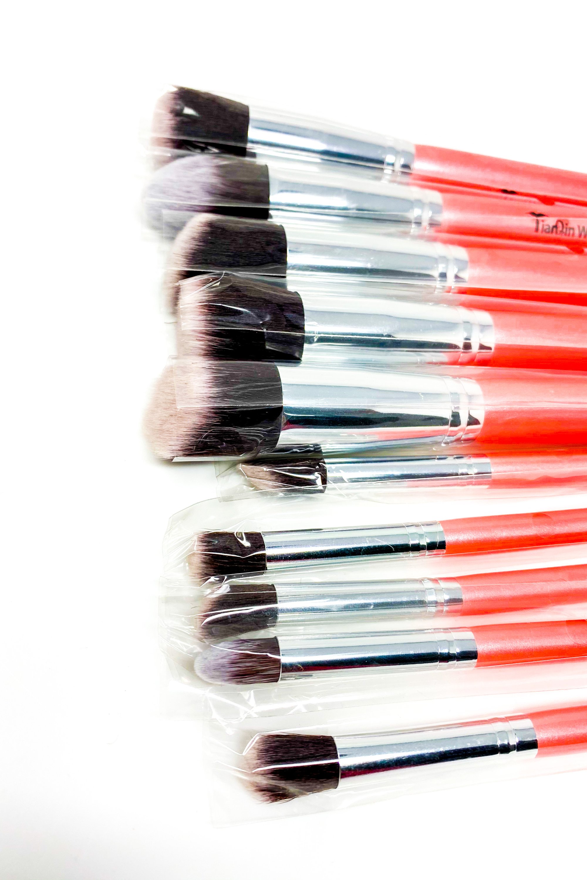 Everything Beat 10 Piece Makeup Brush Set featuring various brushes in multiple colors with a resealable storage tote.