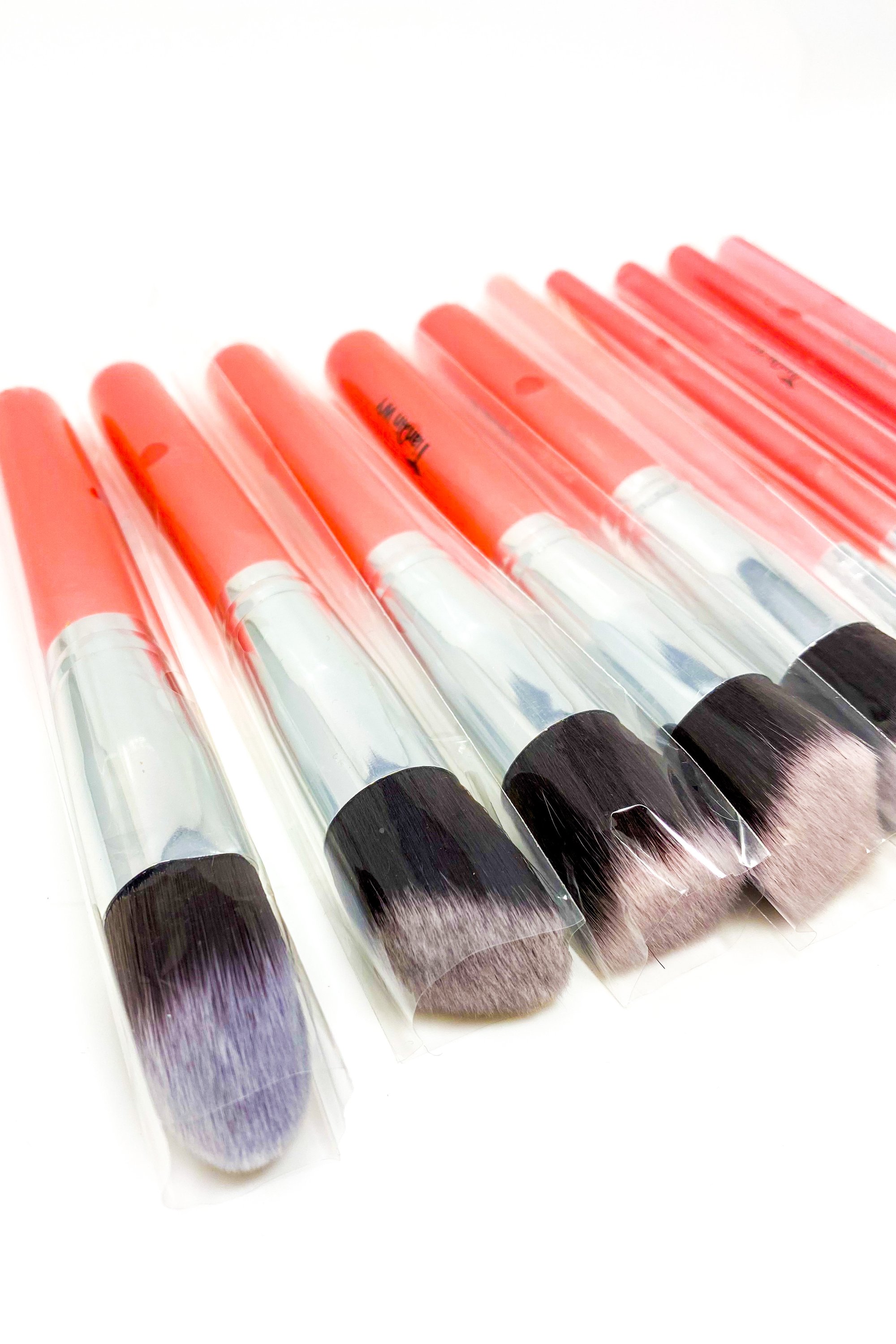 Everything Beat 10 Piece Makeup Brush Set featuring various brushes in multiple colors with a resealable storage tote.