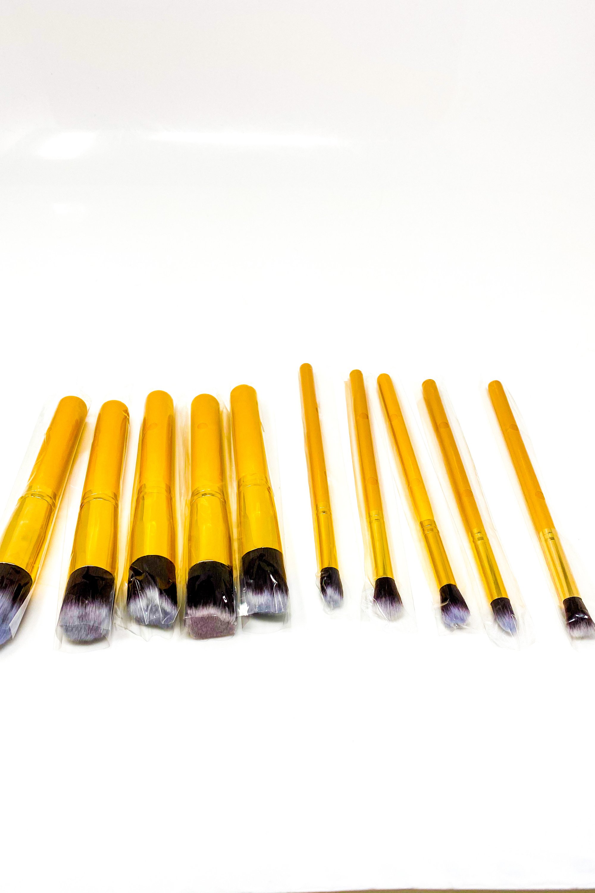 Everything Beat 10 Piece Makeup Brush Set featuring various brushes in multiple colors with a resealable storage tote.