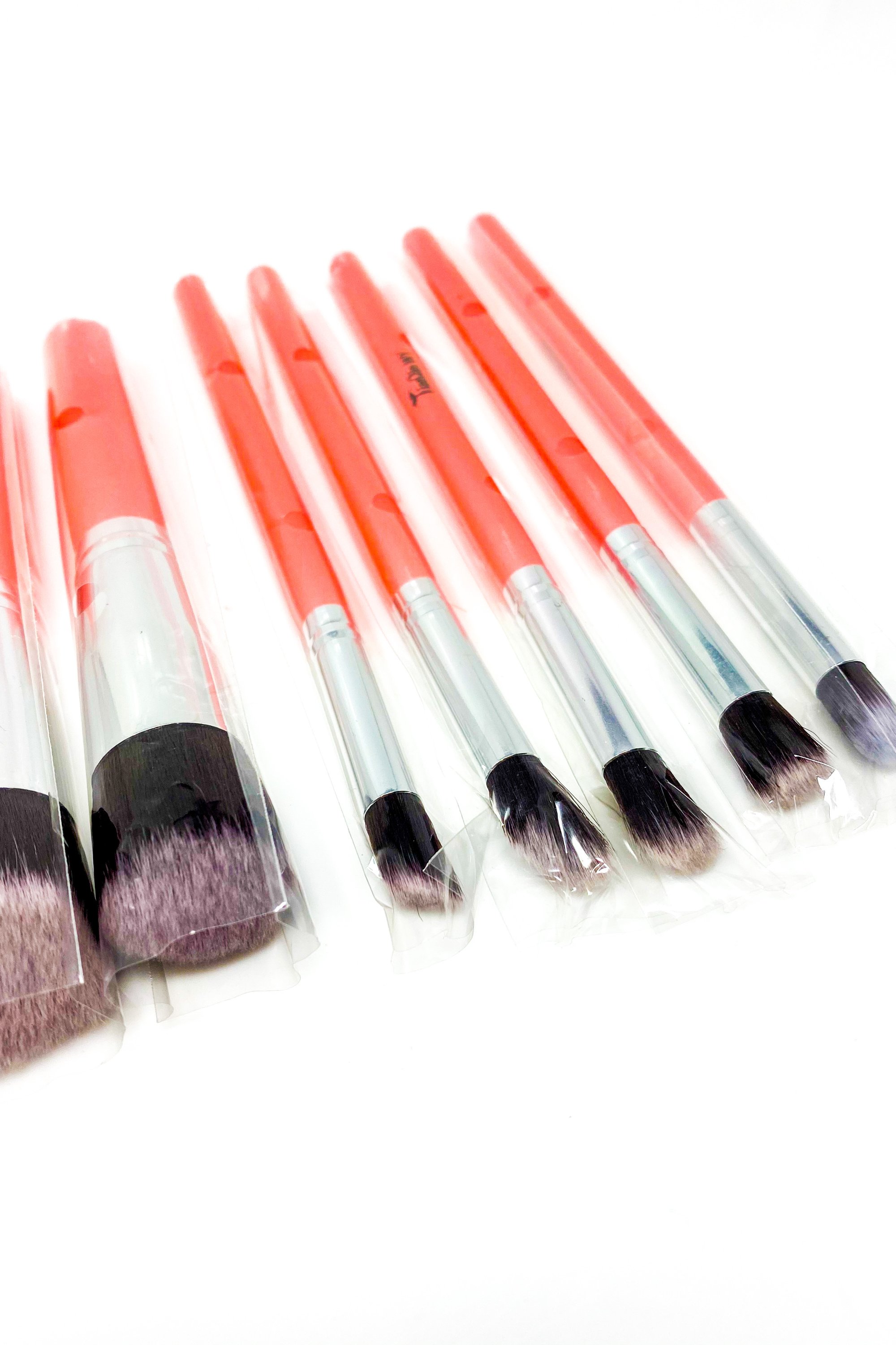 Everything Beat 10 Piece Makeup Brush Set featuring various brushes in multiple colors with a resealable storage tote.